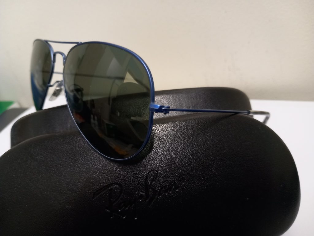 Calvin Klein and Rayban shades