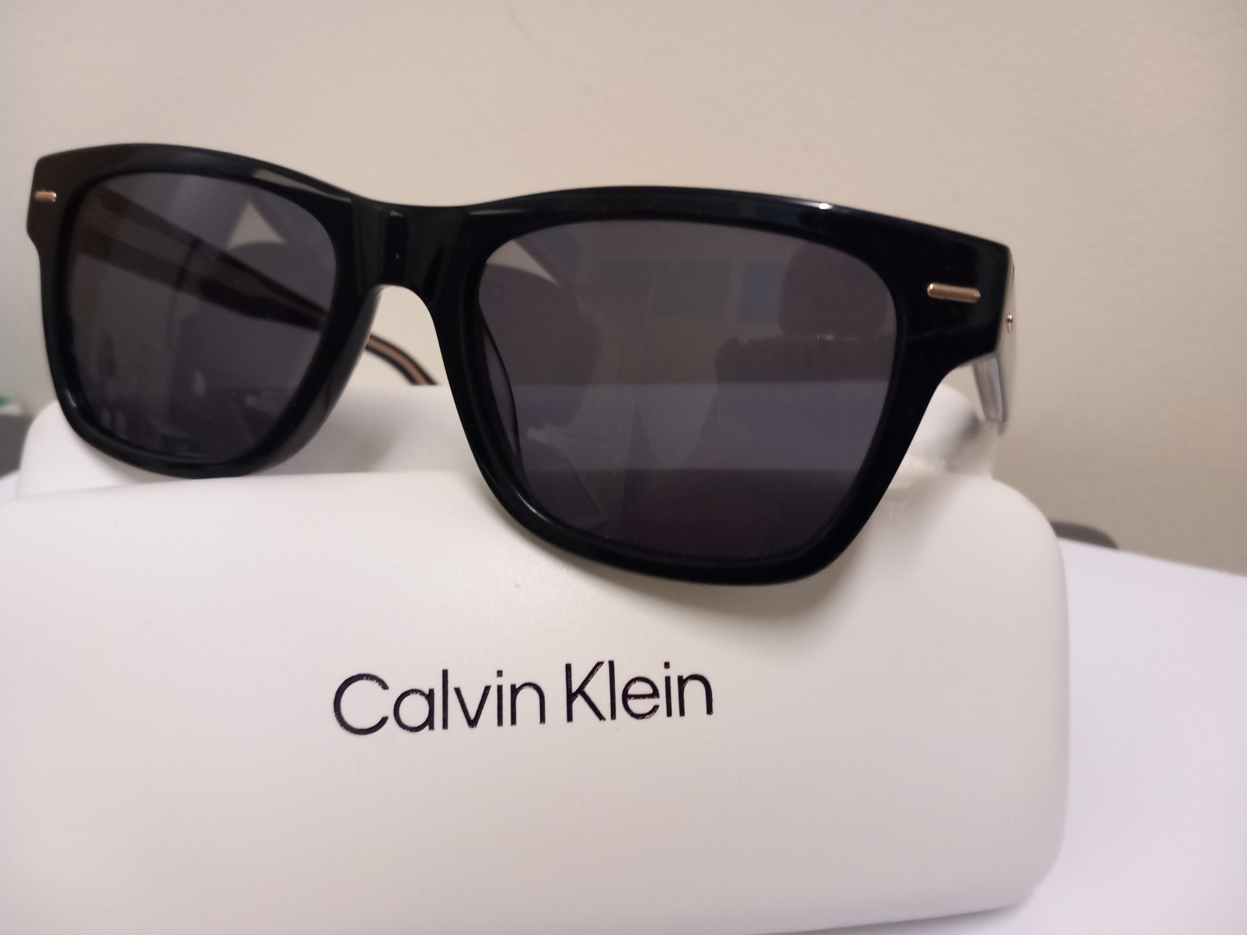 Calvin Klein and Rayban shades