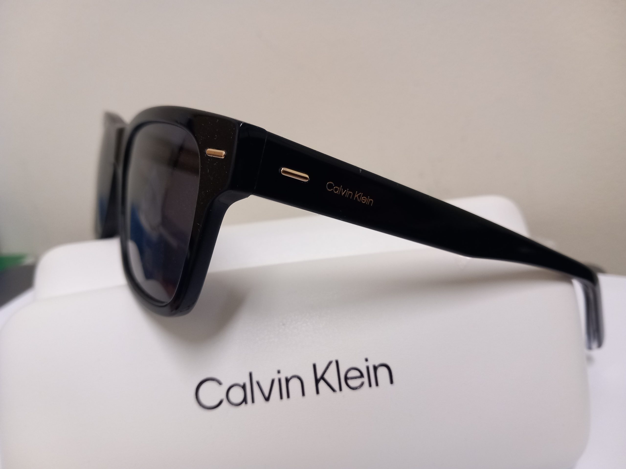 Calvin Klein and Rayban shades