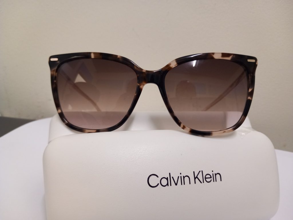 Calvin Klein and Rayban shades