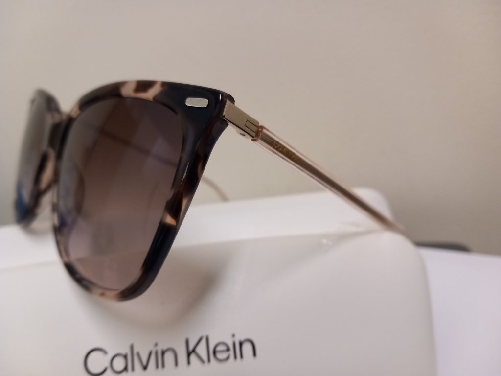 Calvin Klein and Rayban shades